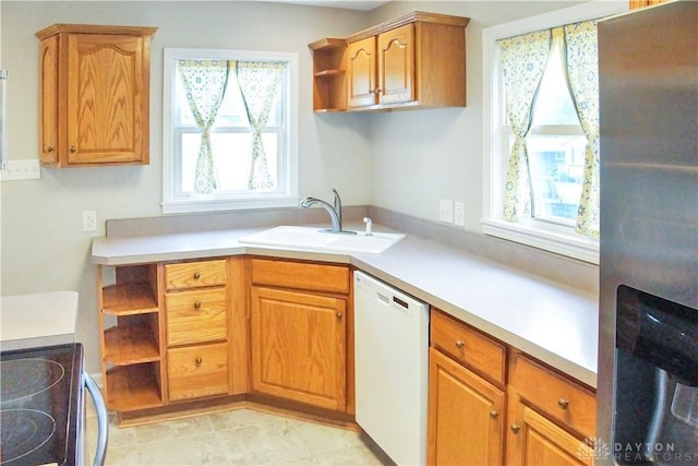 3145 Mohican Ave, Kettering, OH 45429 - kitchen with stainless steel refrigerator with ice dispenser, white dishwasher, open shelves, a sink, and light countertops
