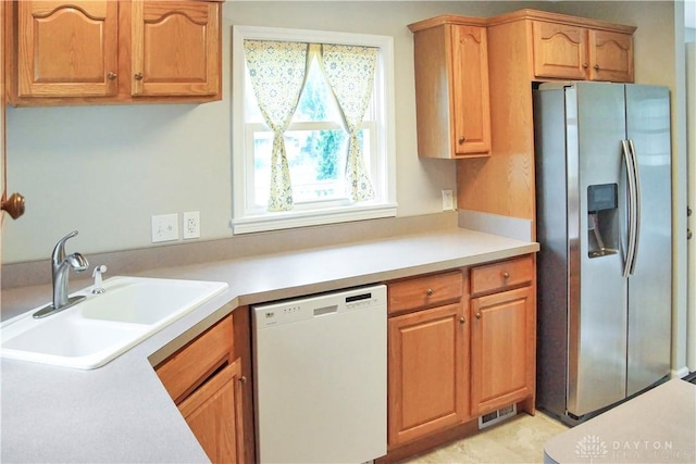 3145 Mohican Ave, Kettering, OH 45429 - kitchen with stainless steel fridge with ice dispenser, dishwasher, a sink, and light countertops