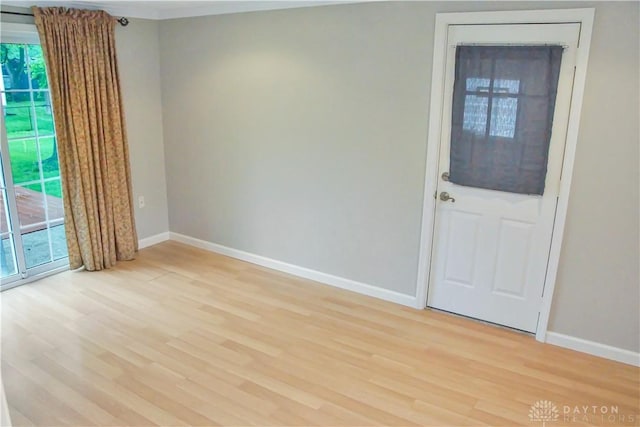 3145 Mohican Ave, Kettering, OH 45429 - spare room featuring light wood-type flooring, healthy amount of natural light, and baseboards
