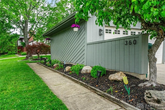 360 Merrick Dr, Beavercreek, OH 45434 - view of home's exterior featuring a lawn and a garage