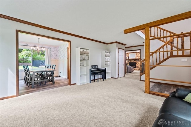 360 Merrick Dr, Beavercreek, OH 45434 - carpeted living area with stairway, baseboards, crown molding, and a chandelier