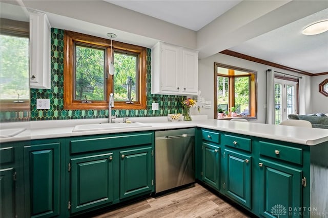360 Merrick Dr, Beavercreek, OH 45434 - kitchen with dishwasher, a sink, white cabinetry, a peninsula, and light countertops