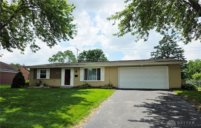 1008 Terracewood Dr, Englewood, OH 45322 - ranch-style home featuring asphalt driveway, an attached garage, a front yard, and brick siding