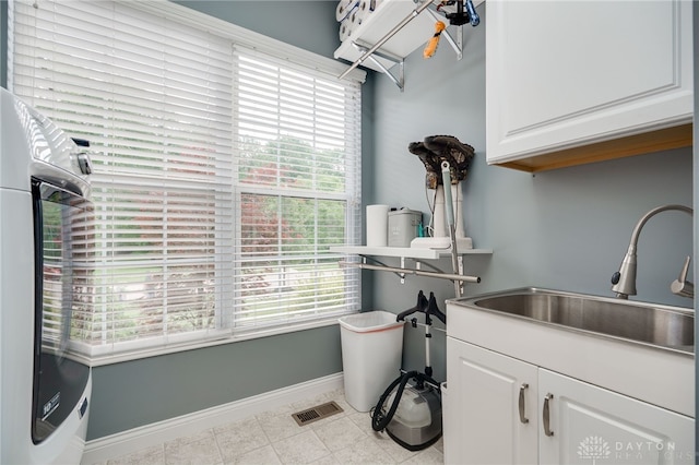 4037 Andora Blvd, Amelia, OH 45102 - washroom with cabinet space, plenty of natural light, and baseboards