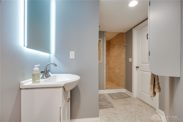 4037 Andora Blvd, Amelia, OH 45102 - full bath with vanity, a tile shower, and baseboards