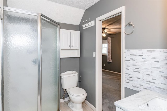 520 Buttercup Ave, Vandalia, OH 45377 - full bath with a ceiling fan, a shower stall, and a textured ceiling