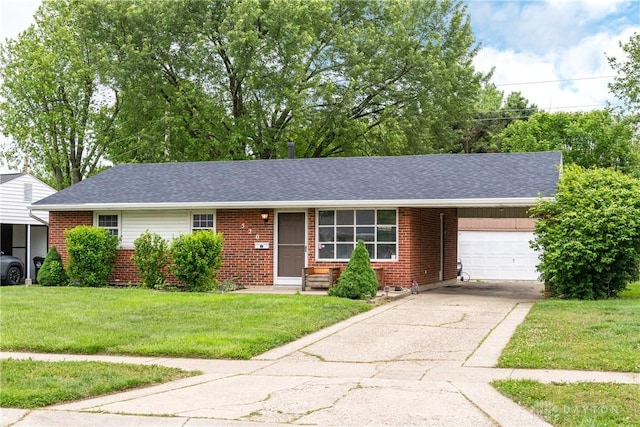 520 Buttercup Ave, Vandalia, OH 45377 - ranch-style house featuring an attached garage, brick siding, a front lawn, driveway, and roof with shingles