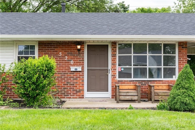 520 Buttercup Ave, Vandalia, OH 45377 - doorway to property with roof with shingles and brick siding