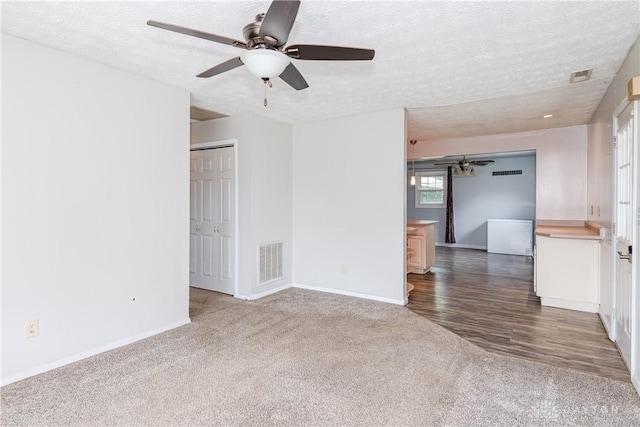 520 Buttercup Ave, Vandalia, OH 45377 - spare room with carpet, a textured ceiling, and a ceiling fan