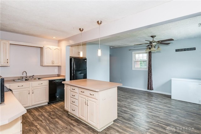 520 Buttercup Ave, Vandalia, OH 45377 - kitchen with black appliances, dark wood finished floors, light countertops, pendant lighting, and a textured ceiling