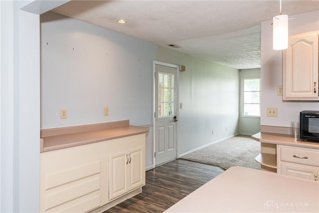 520 Buttercup Ave, Vandalia, OH 45377 - kitchen featuring light countertops, black microwave, a textured ceiling, and dark wood-style floors