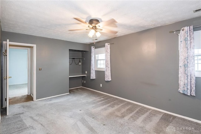 520 Buttercup Ave, Vandalia, OH 45377 - unfurnished bedroom featuring carpet, a textured ceiling, and a ceiling fan