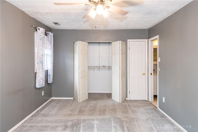 520 Buttercup Ave, Vandalia, OH 45377 - unfurnished bedroom featuring carpet, a ceiling fan, and a textured ceiling