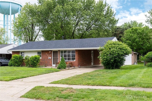 520 Buttercup Ave, Vandalia, OH 45377 - ranch-style home featuring brick siding, a front lawn, driveway, a carport, and roof with shingles