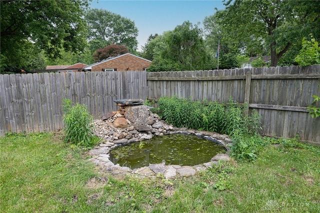 1172 Bay Ln, Beavercreek, OH 45430 - fenced backyard with a garden pond