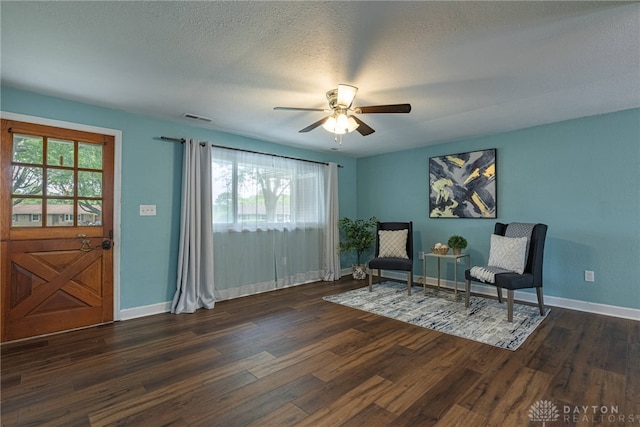 1172 Bay Ln, Beavercreek, OH 45430 - living area featuring plenty of natural light, dark wood finished floors, a ceiling fan, and a textured ceiling