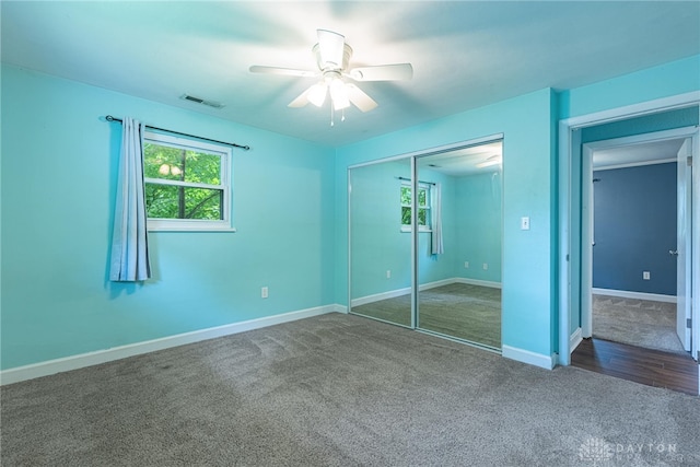 1172 Bay Ln, Beavercreek, OH 45430 - unfurnished bedroom featuring carpet flooring, a closet, baseboards, and ceiling fan