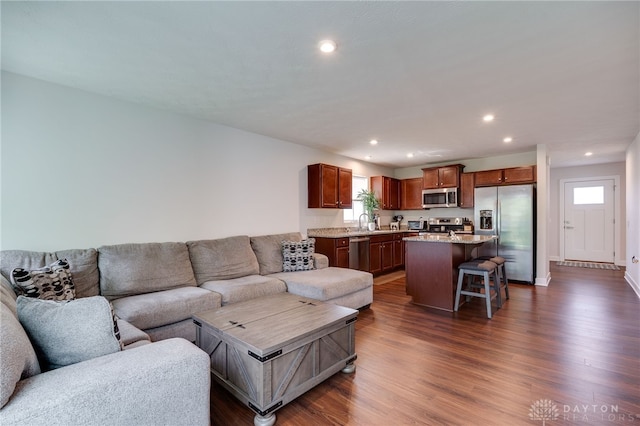 6709 Crystal Harbour Dr, Middletown, OH 45042 - living area featuring dark wood-style floors, healthy amount of natural light, recessed lighting, and baseboards