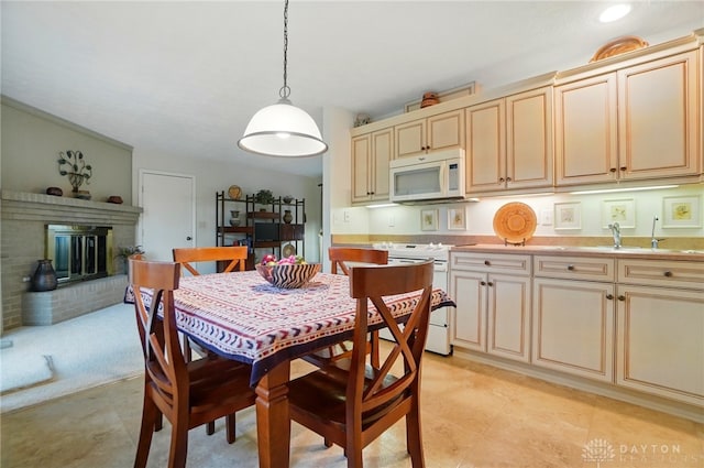 348 Cambridge Dr, Fairborn, OH 45324 - dining room with a brick fireplace
