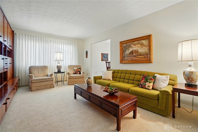 348 Cambridge Dr, Fairborn, OH 45324 - living area with light colored carpet and a textured ceiling