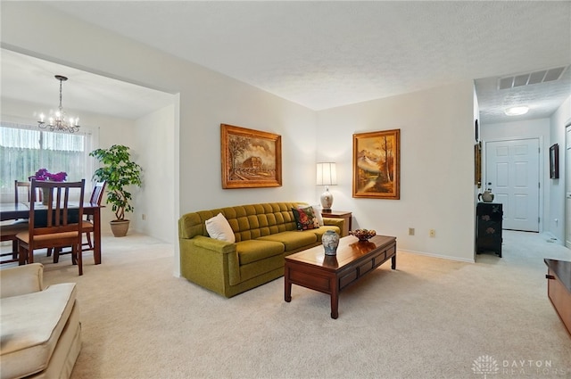 348 Cambridge Dr, Fairborn, OH 45324 - living area with light colored carpet, a chandelier, and baseboards
