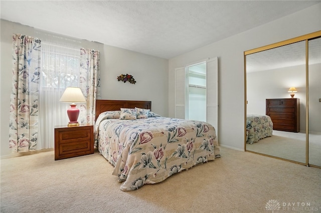 348 Cambridge Dr, Fairborn, OH 45324 - carpeted bedroom featuring multiple closets