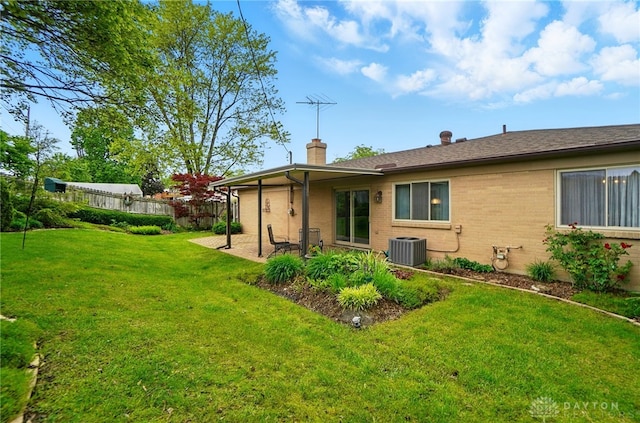 348 Cambridge Dr, Fairborn, OH 45324 - rear view of property featuring a chimney, central AC unit, a patio area, and brick siding