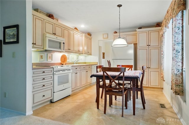 348 Cambridge Dr, Fairborn, OH 45324 - kitchen featuring white appliances, cream cabinetry, decorative light fixtures, baseboards, and recessed lighting
