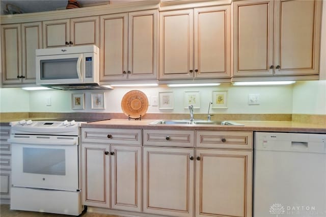 348 Cambridge Dr, Fairborn, OH 45324 - kitchen featuring white appliances, a sink, light countertops, and cream cabinetry