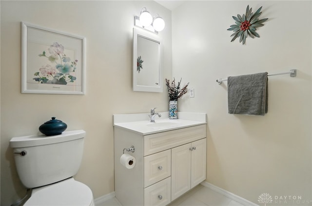 348 Cambridge Dr, Fairborn, OH 45324 - half bathroom with vanity, toilet, and baseboards
