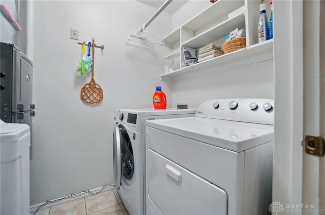348 Cambridge Dr, Fairborn, OH 45324 - washroom featuring washer and dryer and light tile patterned floors
