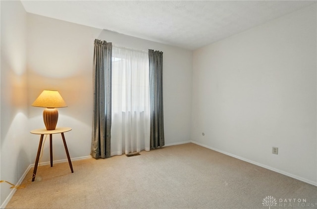 348 Cambridge Dr, Fairborn, OH 45324 - carpeted empty room featuring baseboards