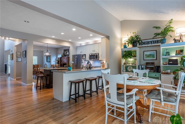989 Brooke Ln, Xenia, OH 45385 - dining space featuring light wood-type flooring, recessed lighting, and baseboards