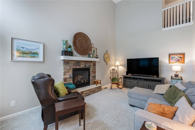 989 Brooke Ln, Xenia, OH 45385 - living room featuring carpet floors, baseboards, a fireplace, and a high ceiling