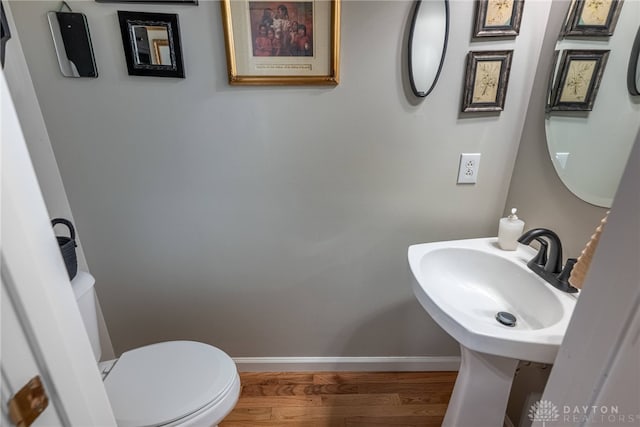 989 Brooke Ln, Xenia, OH 45385 - bathroom featuring wood finished floors, baseboards, and toilet