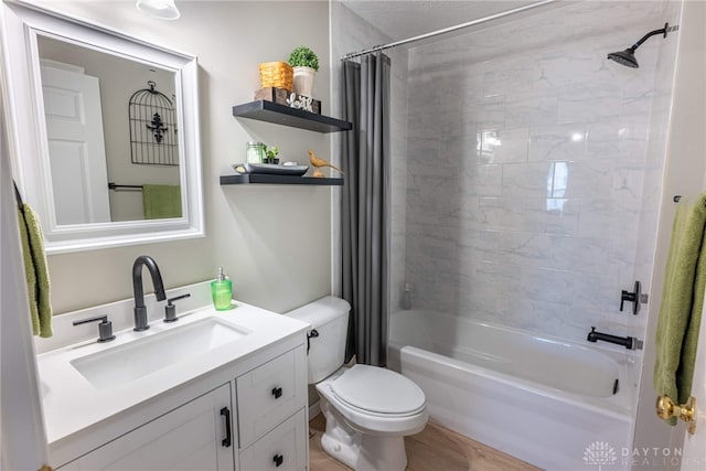 989 Brooke Ln, Xenia, OH 45385 - bathroom with toilet, shower / bath combo with shower curtain, vanity, and wood finished floors