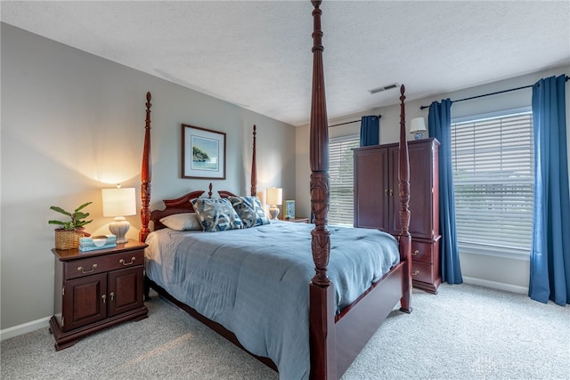 989 Brooke Ln, Xenia, OH 45385 - bedroom with light carpet, baseboards, and a textured ceiling