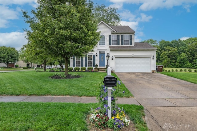 989 Brooke Ln, Xenia, OH 45385 - view of front facade with concrete driveway, a front yard, and a shingled roof