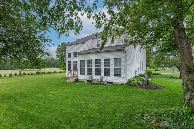 989 Brooke Ln, Xenia, OH 45385 - back of property featuring entry steps, a yard, roof with shingles, and cooling unit