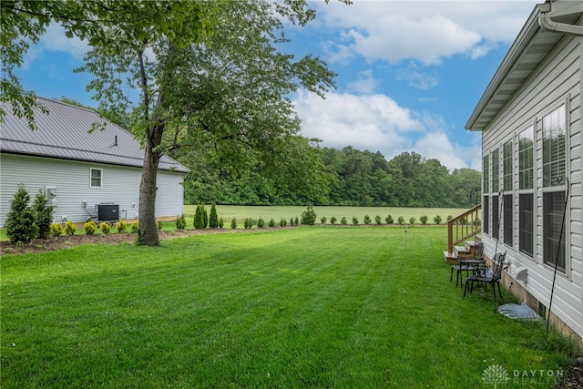 989 Brooke Ln, Xenia, OH 45385 - view of grassy yard with central AC unit