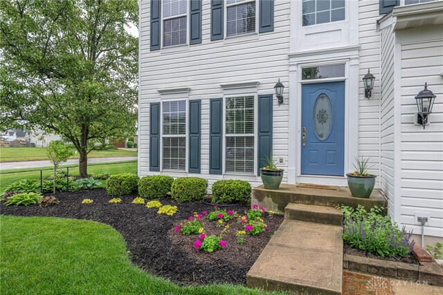989 Brooke Ln, Xenia, OH 45385 - doorway to property with a lawn