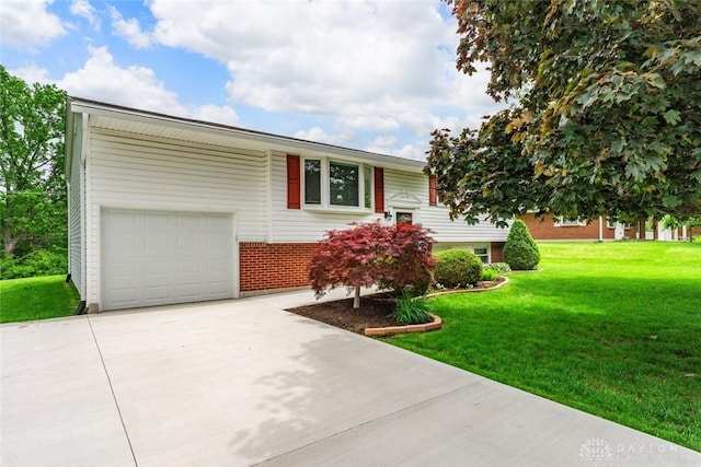 2707 Rockledge Trl, Beavercreek, OH 45430 - view of front facade with concrete driveway, a front lawn, brick siding, and an attached garage