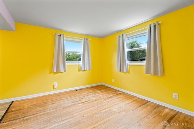 2707 Rockledge Trl, Beavercreek, OH 45430 - spare room featuring plenty of natural light, wood finished floors, and baseboards