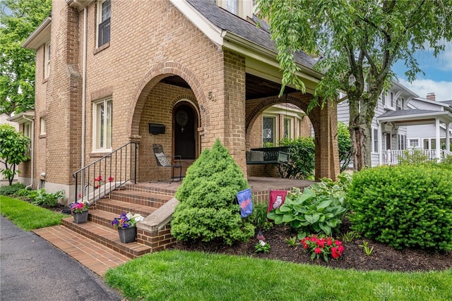 54 Beverly Pl, Oakwood, OH 45419 - view of front of home with brick siding and a porch