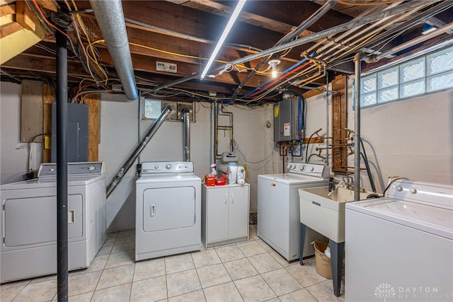54 Beverly Pl, Oakwood, OH 45419 - washroom with washer and dryer, electric panel, and light tile patterned floors