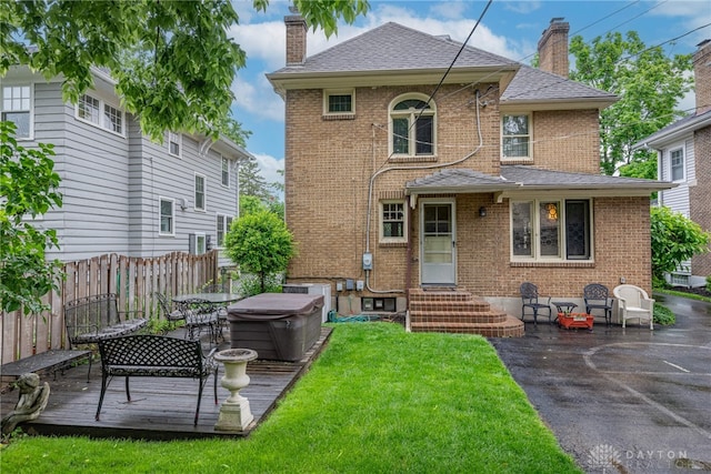 54 Beverly Pl, Oakwood, OH 45419 - back of property featuring a chimney, entry steps, brick siding, a wooden deck, and a shingled roof