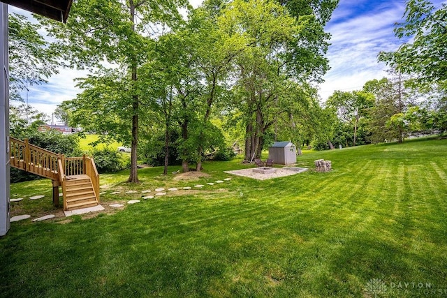 4723 Rosedale Rd, Middletown, OH 45042 - view of green lawn with stairs, view of wooded area, and a wooden deck