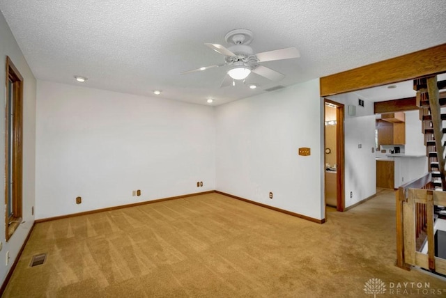 4723 Rosedale Rd, Middletown, OH 45042 - spare room with light carpet, ceiling fan, baseboards, a textured ceiling, and recessed lighting