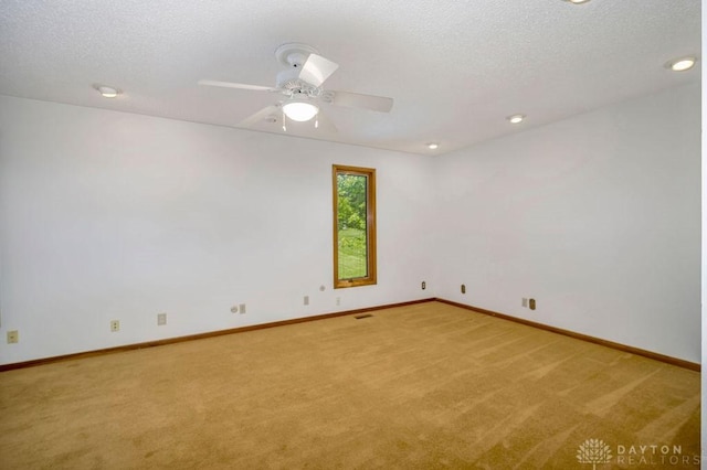 4723 Rosedale Rd, Middletown, OH 45042 - spare room featuring light carpet, baseboards, ceiling fan, a textured ceiling, and recessed lighting
