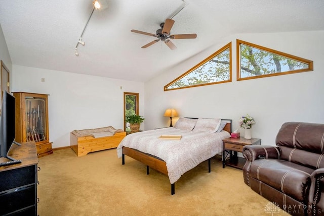 4723 Rosedale Rd, Middletown, OH 45042 - bedroom with light carpet, vaulted ceiling, ceiling fan, baseboards, and track lighting